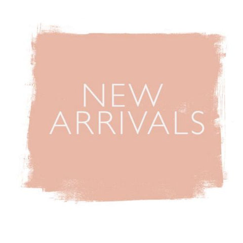 Pink sigh with the words new arrivals on for the new in store collection